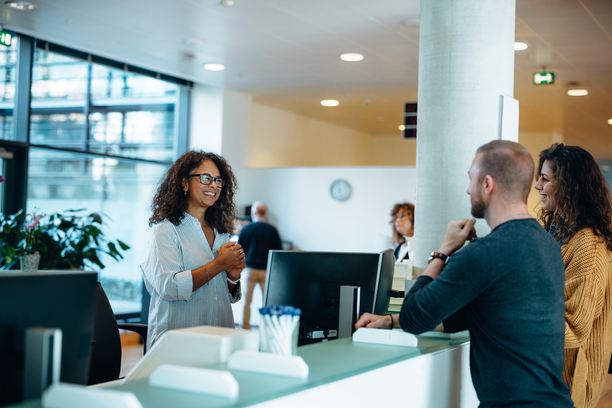 three people collaborating in office