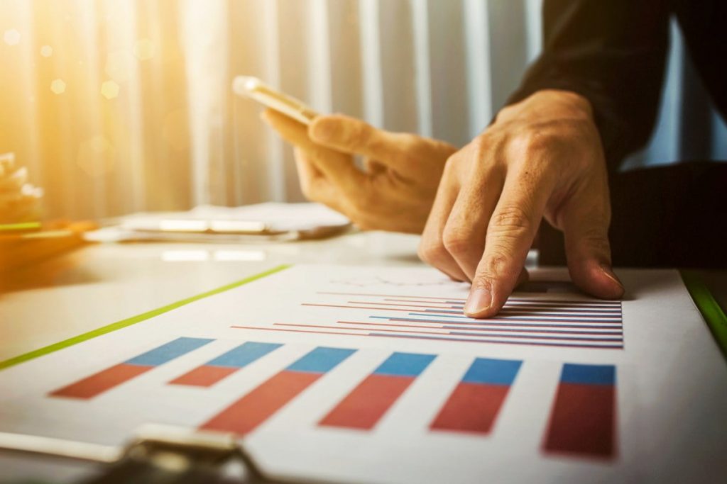 businessman showing data on paper