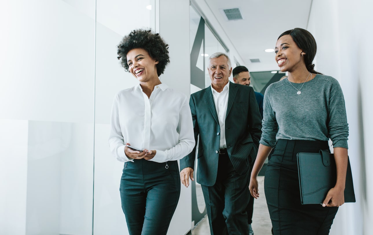 group walking into meeting