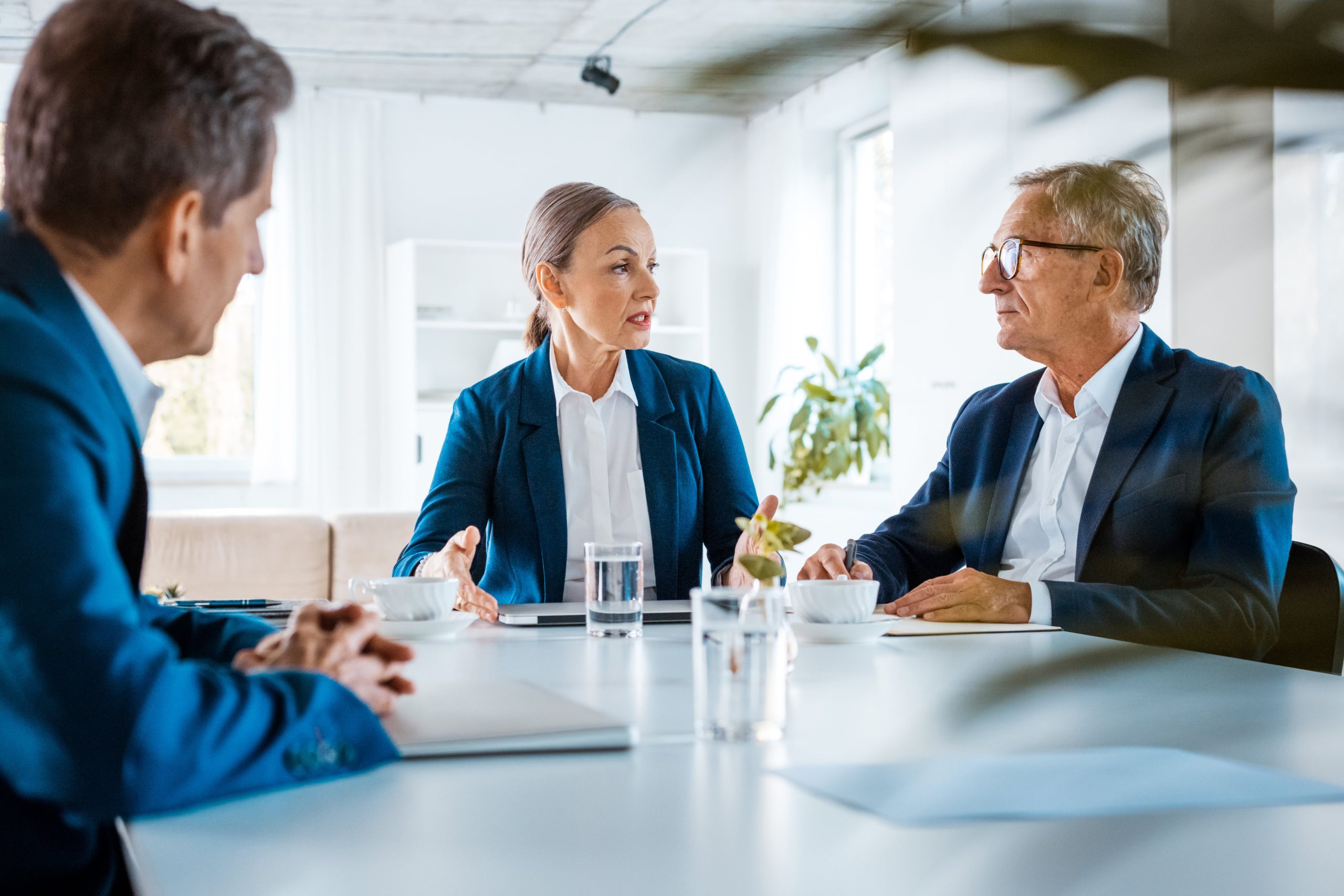 three people having a work discussion