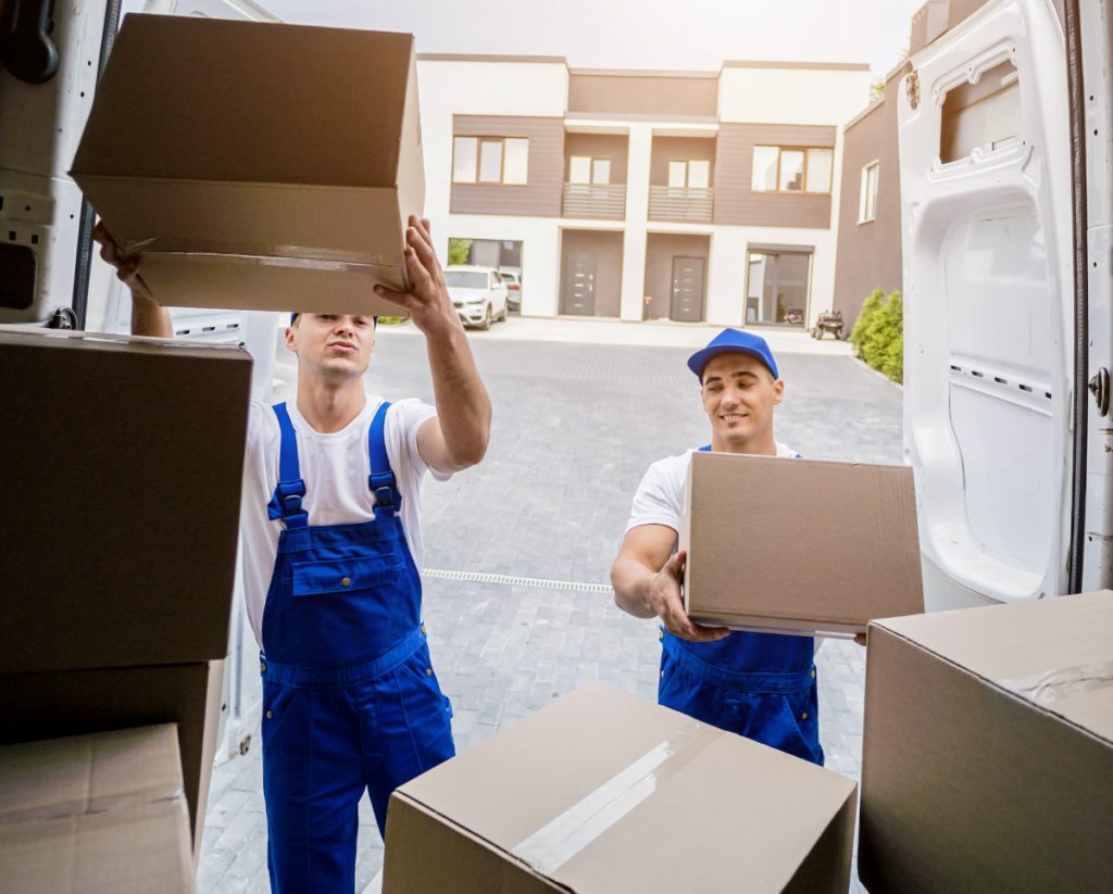 movers unloading boxes from truck