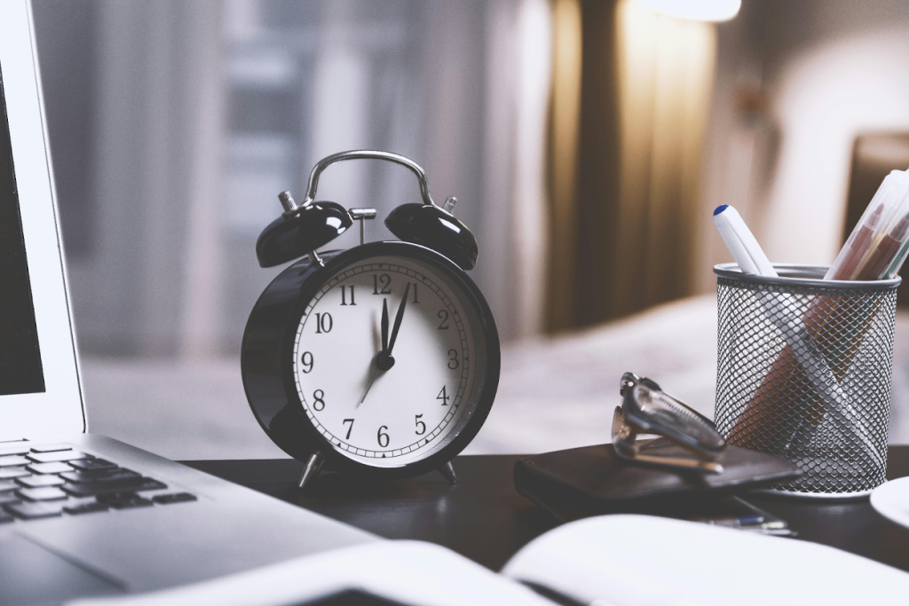 Black alarm clock on office desk