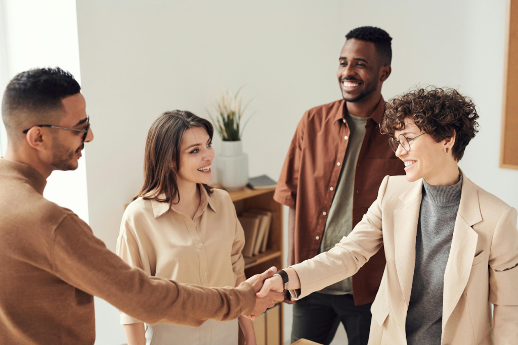 Business professionals shaking hands in an office setting
