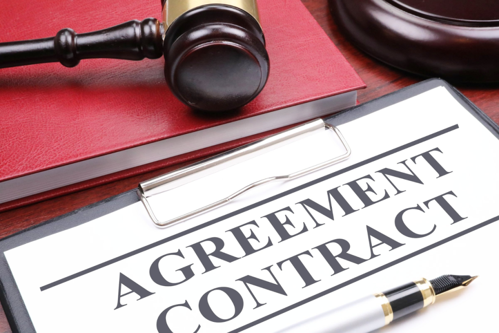 Agreement contract document with gavel and pen