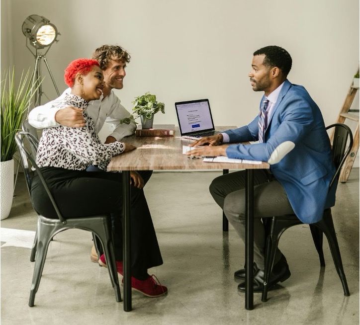 Business owner reviewing credit applications and payment terms with client