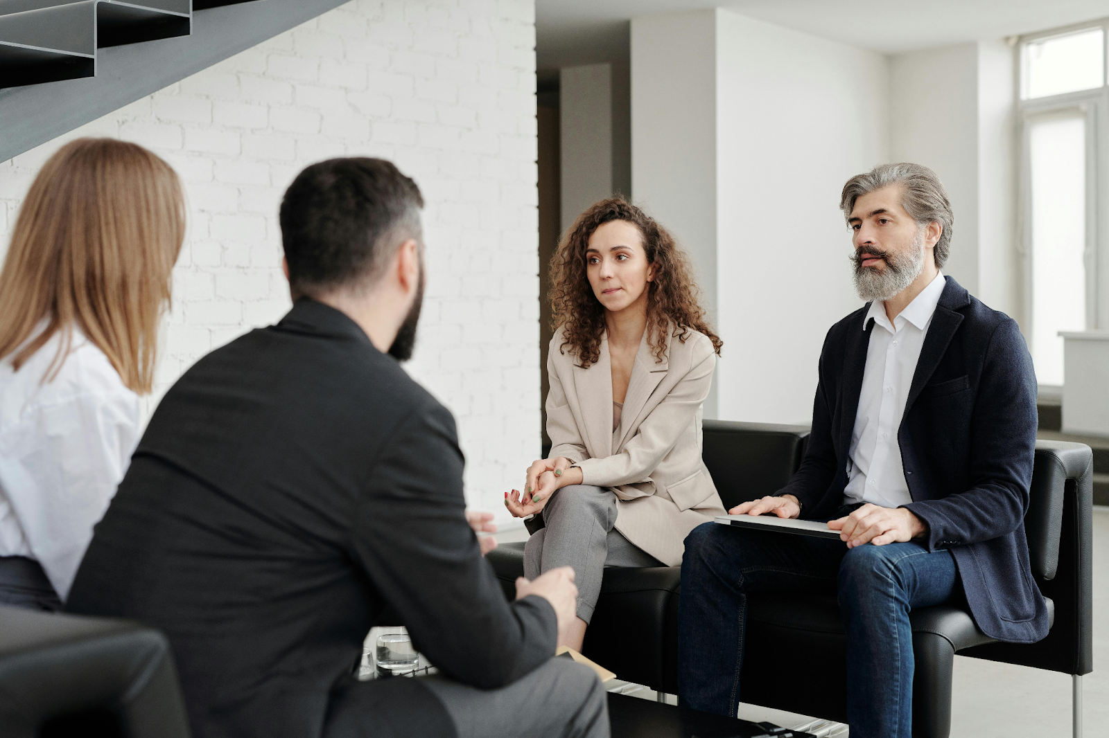 Business team meeting in a contemporary workspace.