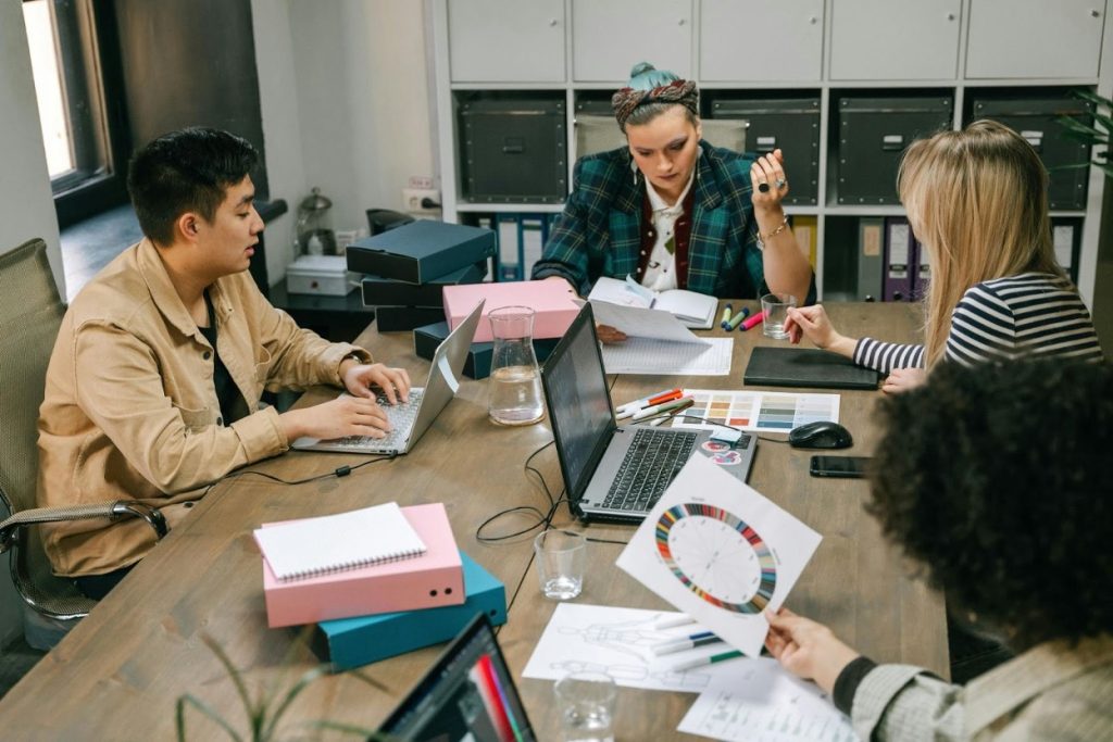 Professional collection agency team reviewing account files
