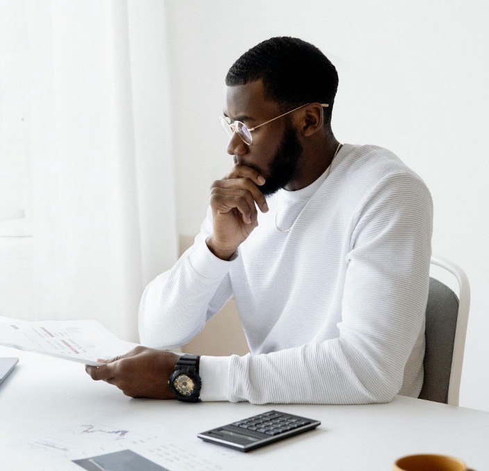 Business owner reviewing collection agency pricing proposals