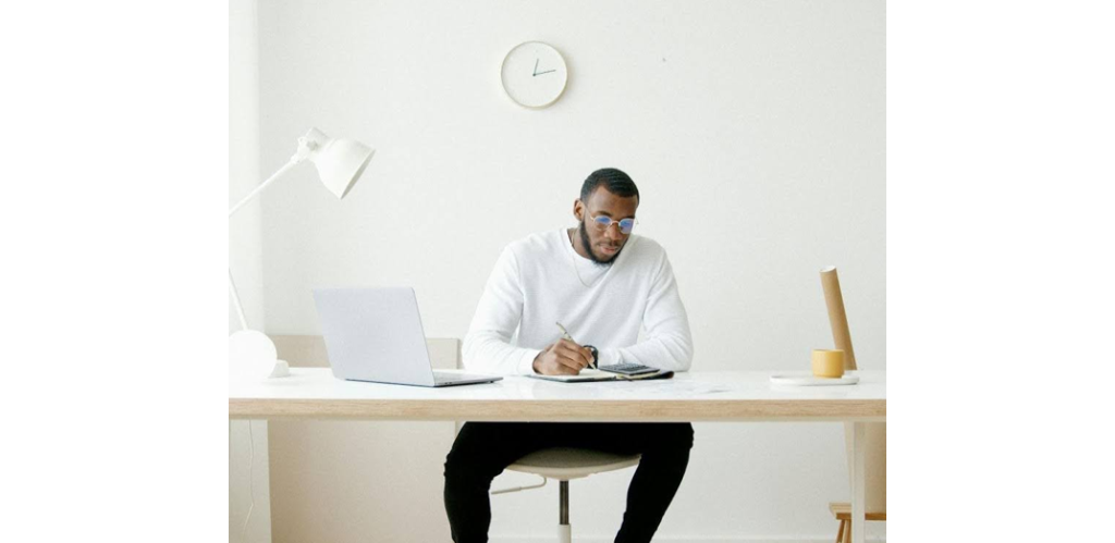 Business owner reviewing improved cash flow reports after engaging collection services.