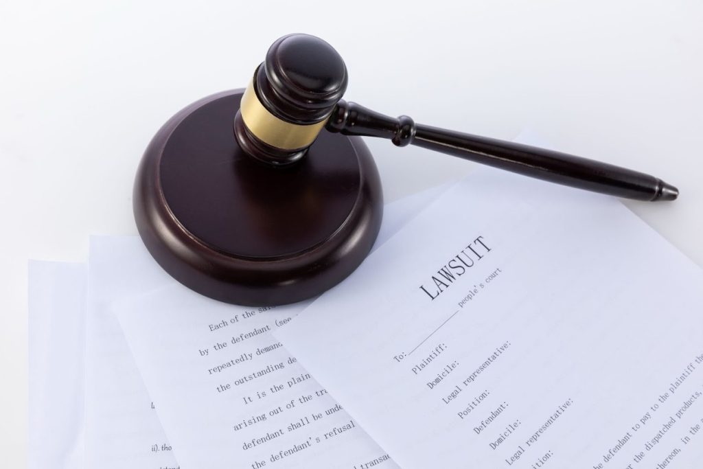 Close-up of legal documents and a gavel on an office desk