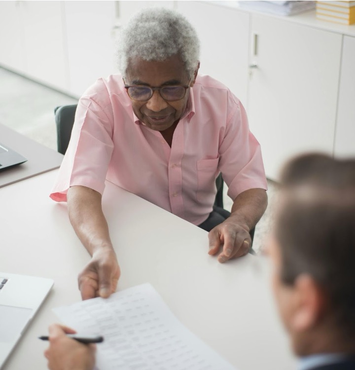 Professional debt collection consultation between a business owner and a collections specialist